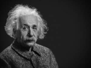 Albert Einstein learning to play a musical instrument.jpg